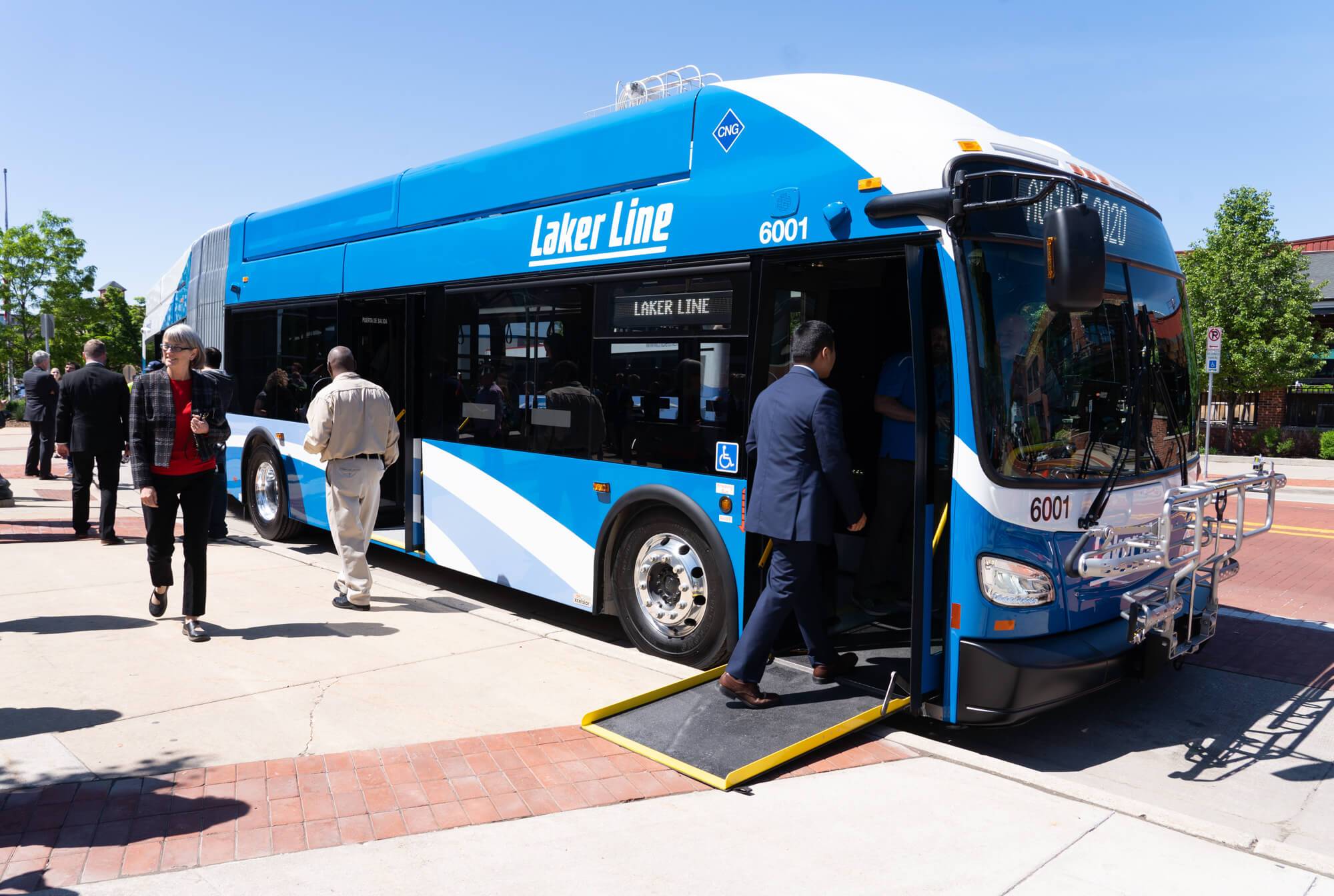 Passengers loading and unloading on the new Laker Line bus.